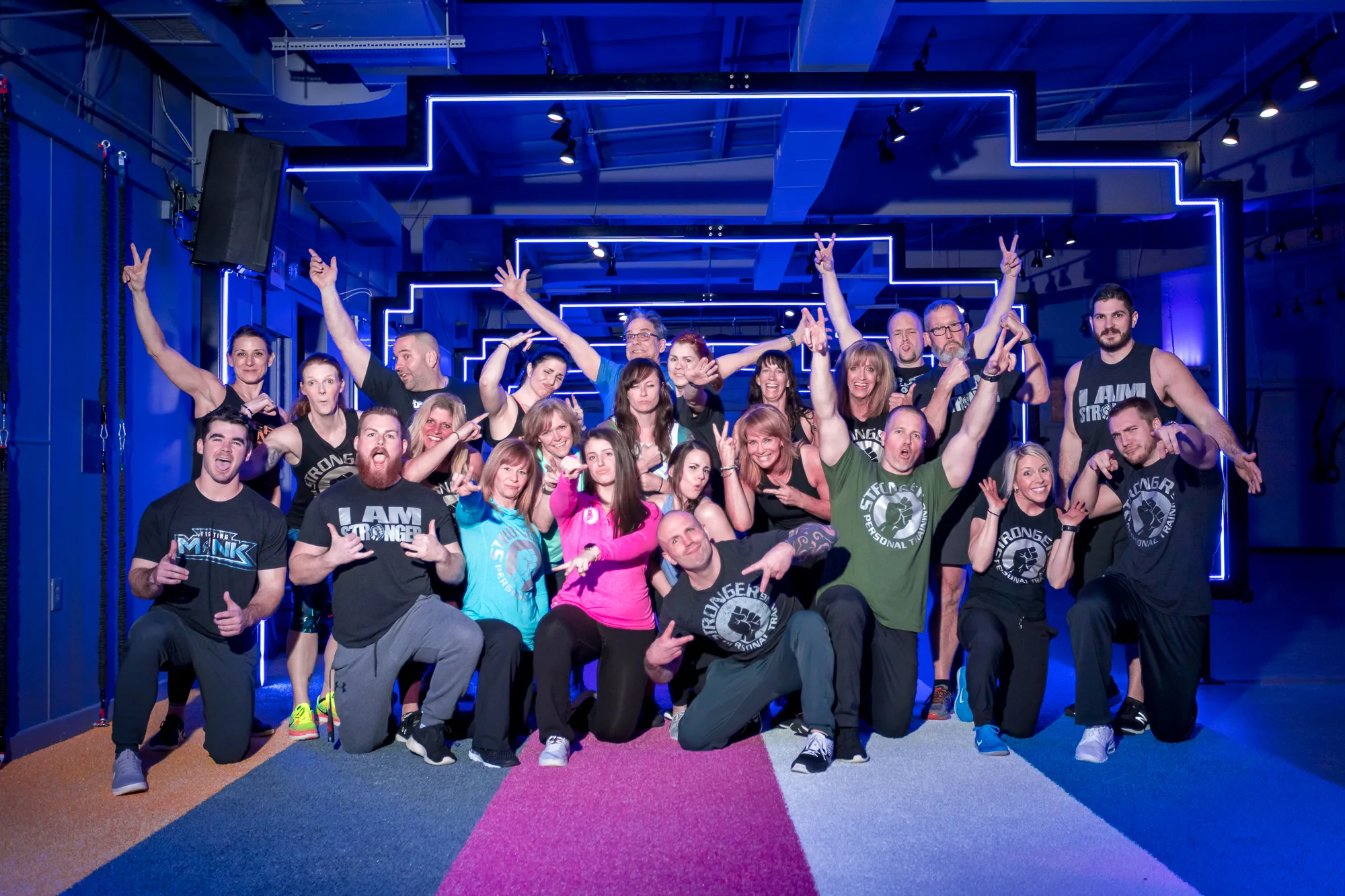 Stronger members celebrating together with raised hands.